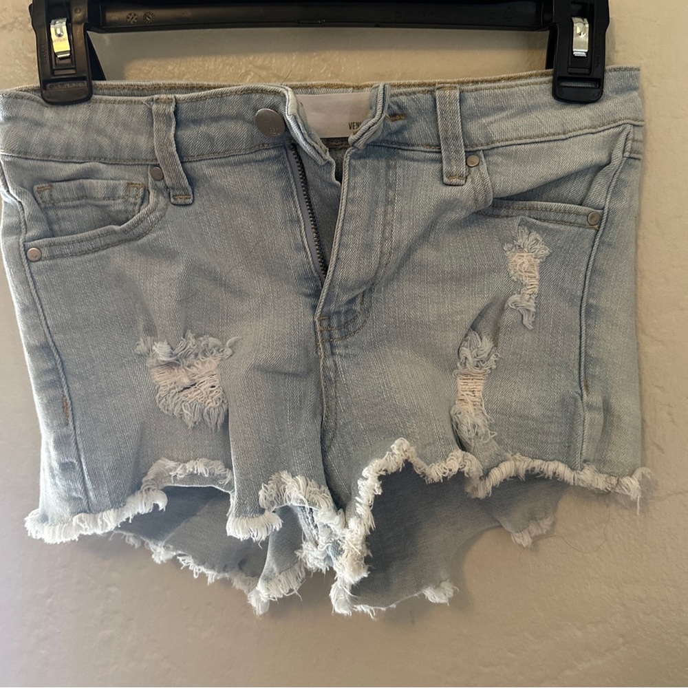 Mid rise jean shorts distressed.